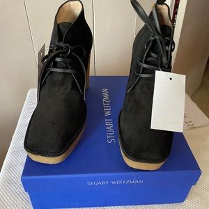 Stuart Weitzman black wedged boots.